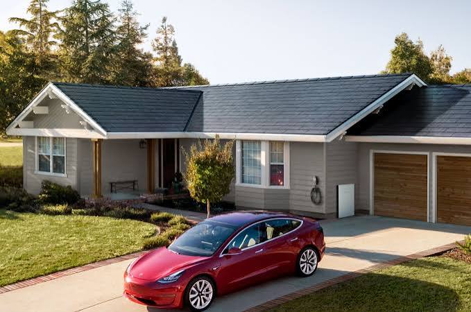 Tesla Solar Roof on a modern home with integrated solar glass tiles